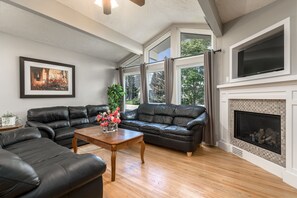 living room w/ fireplace and smart tv