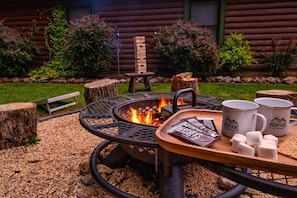 Unwind by the fire pit, indulge in s'mores, and let your family have fun playing corn hole in the refreshing outdoor atmosphere.