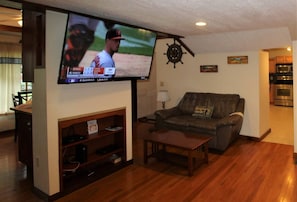 Large 55" (or larger) flat screen smart Roku TV in the living room with cable