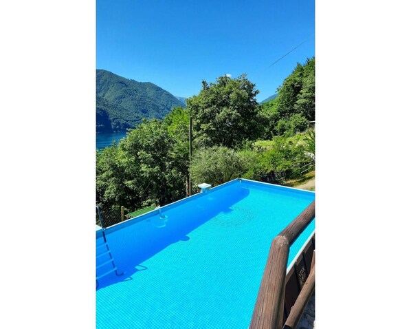 Water, Sky, Water Resources, Property, Swimming Pool, Blue, Azure, Shade, Natural Landscape, Rectangle
