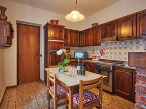 Cabinetry, Furniture, Property, Countertop, Table, Chair, Wood, Drawer, Interior Design, Kitchen