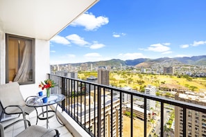 Spacious balcony with mountain view. Patio furniture for a relaxing time