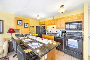Fully equipped kitchen and countertop dining area