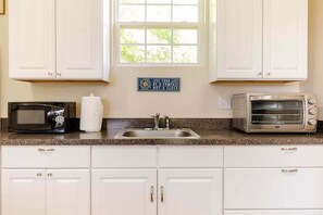 Microwave, toaster oven, coffee makers.  Limited kitchen - no stove