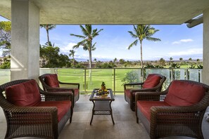 Large wrap lanai with mountain and fairway views.
