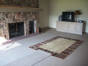 Expansive living room.  Now Furnished.  Sofa,  diningn table & chairs,  etc.
