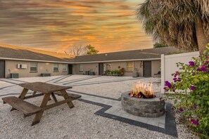 Your beautiful courtyard awaits you, complete with fire pit and corn hole.