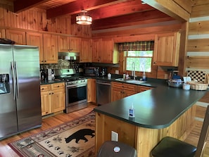 fully appointed kitchen (we have foldable barstools to increase seating)