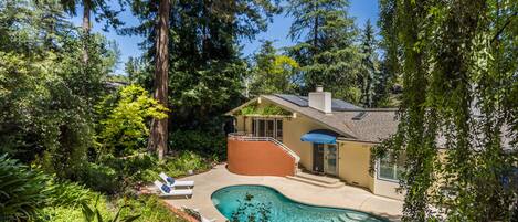 Beautiful backyard tucked in the trees.