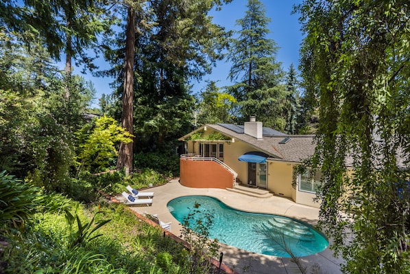 Beautiful backyard tucked in the trees.