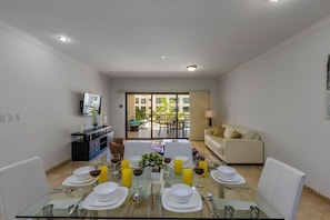 Large Dining Table with a view to the Pool and Amazing Gardens