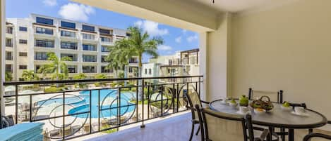 Enjoy the pool view while spending your time on the balcony