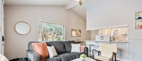 Living room with plenty of seating, sleeper sofa, and smart tv