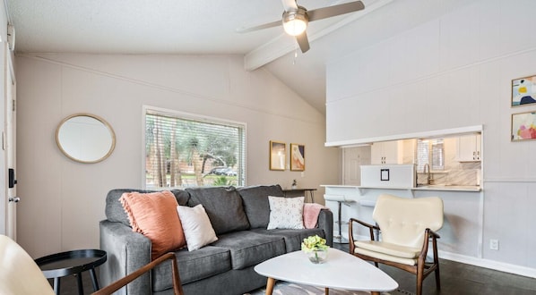 Living room with plenty of seating, sleeper sofa, and smart tv