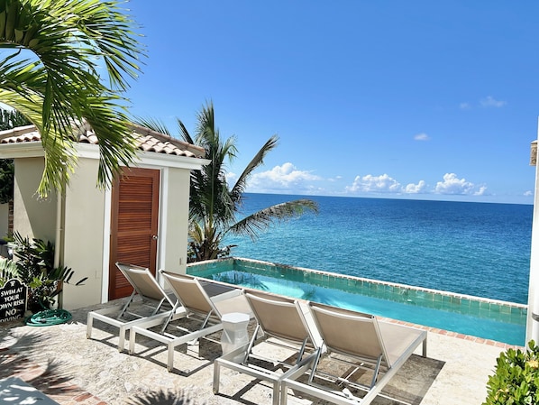 Relax in our private pool overlooking the sea.