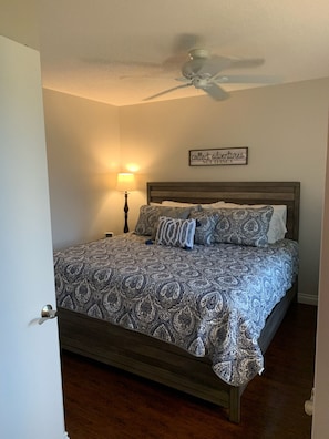 Bedroom #2 with a king bed and home office space.