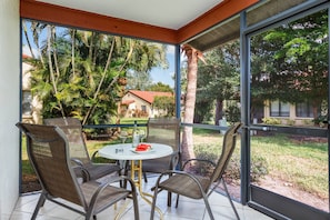 Relax in your private screened-in patio with fresh Florida watermelon and a glass of your favorite vino