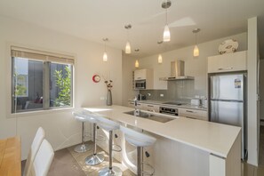 Modern kitchen - oven, stove, fridge, dishwasher and nespresso machine