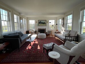 Living room has a working fireplace