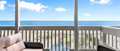 Private deck with outdoor seating, perfect for a morning coffee or afternoon drink (patio furniture not available Nov-Mar)