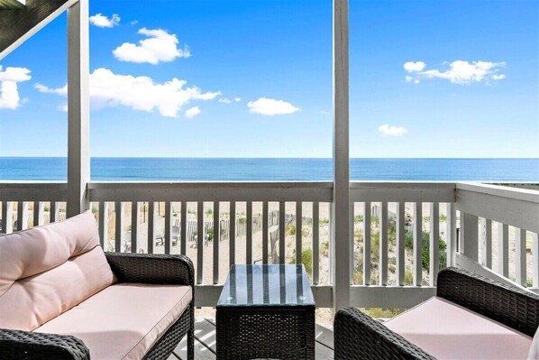 Private deck with outdoor seating, perfect for a morning coffee or afternoon drink (patio furniture not available Nov-Mar)