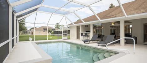 Great Sight Lines - You can watch TV or gaze out at the pool from the Sandy Dreams living room.