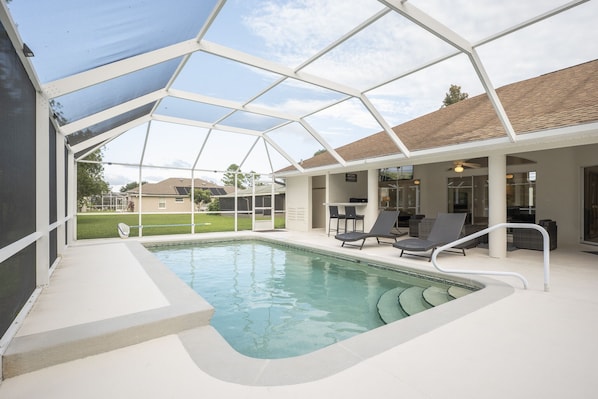 Great Sight Lines - You can watch TV or gaze out at the pool from the Sandy Dreams living room.