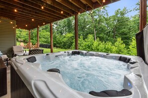 Soak in the private hot tub surrounded by nature.