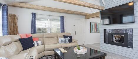 Living room area featuring a flat screen TV.