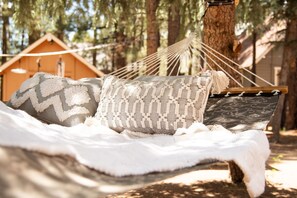 Swing on the large hammock under the shaded trees. (stored away in snow season)
