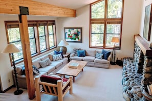 Cozy living room surrounded by views and lots of natural light