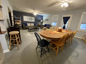 Living room with dining area and access to front porch