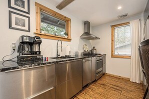 Fully stocked and equipped kitchen for meals at home.