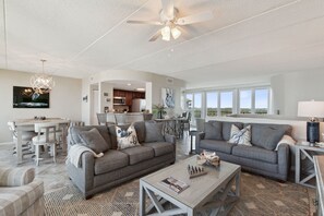 Living Area with Matching Sofa and Loveseat, 2 Comfortable Chairs and Flat Screen TV