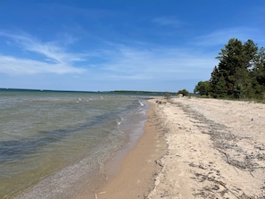 The water is shallow and warm on the private beach