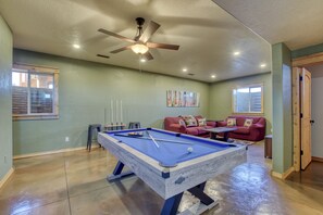 Downstairs Rec Room with pool table, 65" TV, and game console