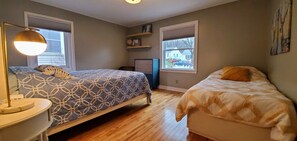 Large first floor bedroom with a twin bed as well. Closet to the right. 