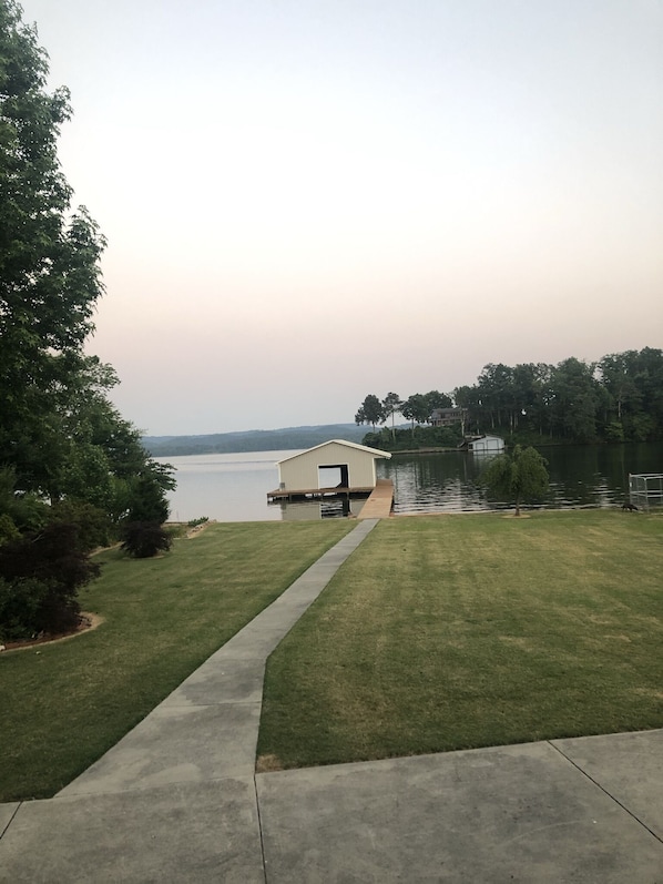 Looking form porch across the yard to the Boathouse.