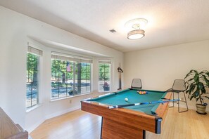 Pool table with bar stools 