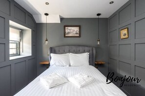 Bedroom 1 with comfortable double bed and en-suite bathroom
