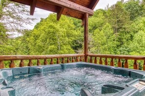 Unwind in the hot tub on the deck, available year-round for the perfect soak in any season.