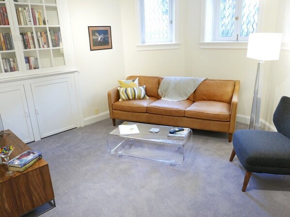 Cozy living area with tons of reading material