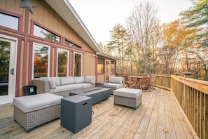 Outdoor lounge area with gas fireplace. 