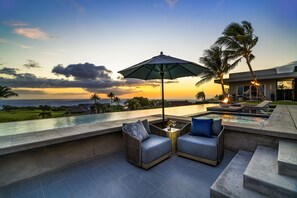 Grill dinner while sipping wine with friends after laps in the 72' infinity edge lane pool as dusk approaches