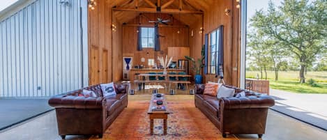 Floor-to-ceiling barn doors can be opened to fully enjoy the views