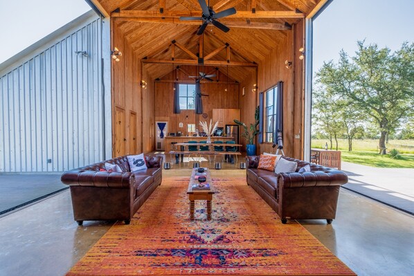 Floor-to-ceiling barn doors can be opened to fully enjoy the views