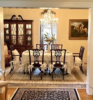 Formal dining room with table for six and beautiful crystal chandelier 