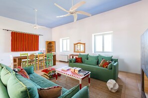 Cosy living room with fireplace, original art, antiques, dining plus wifi & TV