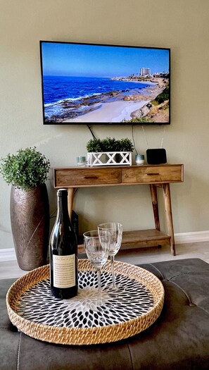 Put your feet up and relax. Both TVs in the unit have streaming services.