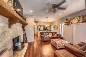 Living Room with smart TV and Queen Murphy Bed.